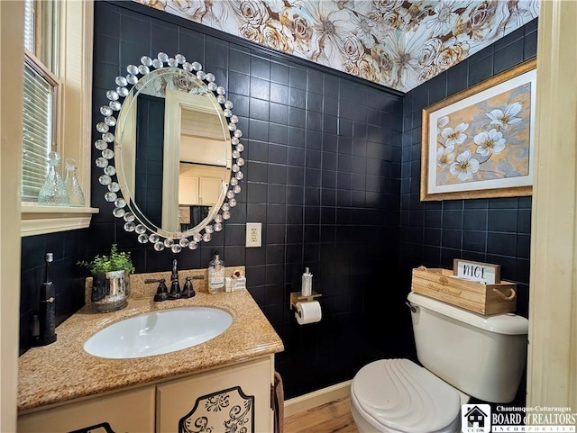 16 Ellis Ave, Jamestown, NY 14701 - half bath featuring tile walls, toilet, vanity, and wood finished floors