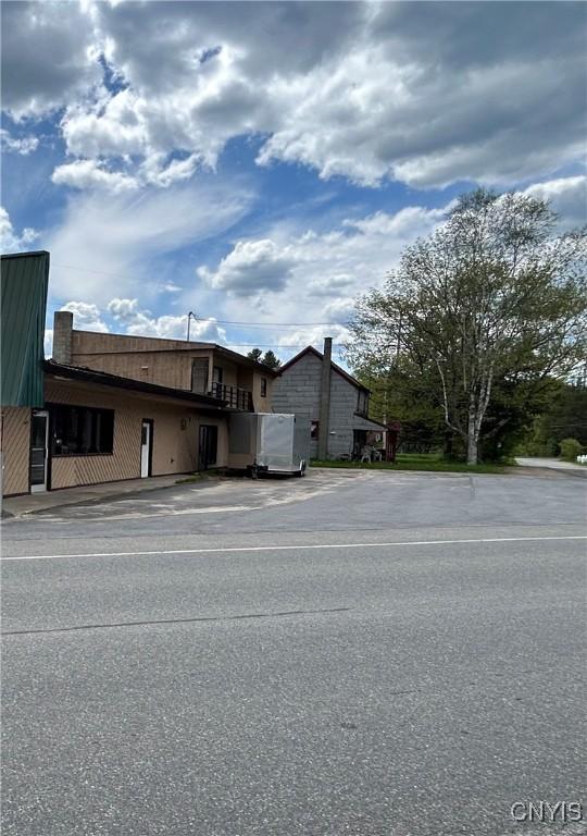 26 Dow Rd, Lake Placid, NY 12946 - view of building exterior featuring uncovered parking