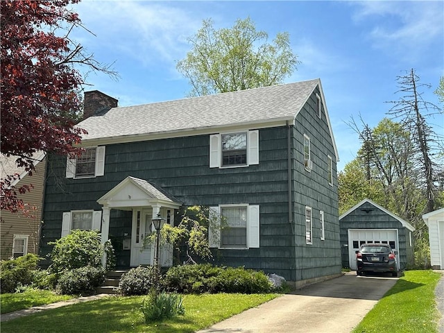 32 Bon Air Ave, Bradford-City, PA 16701 - view of front of house featuring driveway, an outdoor structure, a chimney, a detached garage, and a shingled roof