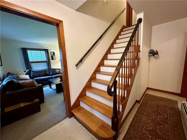 32 Bon Air Ave, Bradford-City, PA 16701 - stairway with carpet floors, a baseboard heating unit, baseboards, and tile patterned flooring