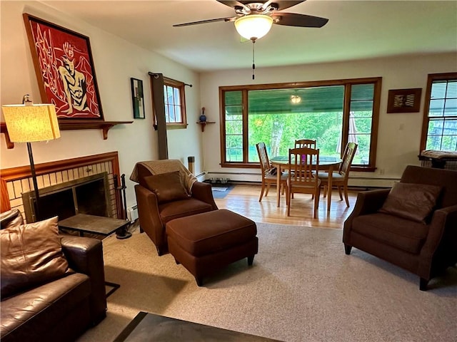 32 Bon Air Ave, Bradford-City, PA 16701 - living area with a ceiling fan, a brick fireplace, a baseboard heating unit, carpet floors, and baseboard heating
