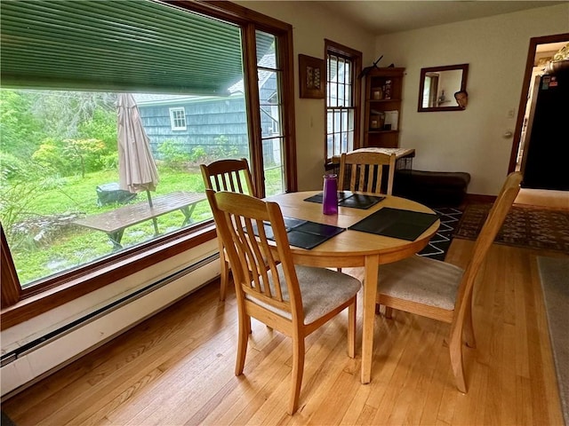 32 Bon Air Ave, Bradford-City, PA 16701 - dining space with baseboard heating, light wood-style flooring, and healthy amount of natural light