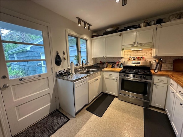 32 Bon Air Ave, Bradford-City, PA 16701 - kitchen featuring gas stove, white dishwasher, a sink, under cabinet range hood, and white cabinetry