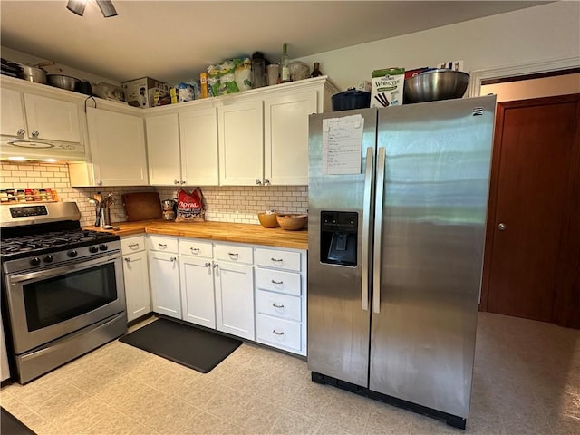 32 Bon Air Ave, Bradford-City, PA 16701 - kitchen featuring stainless steel appliances, under cabinet range hood, white cabinetry, and tasteful backsplash