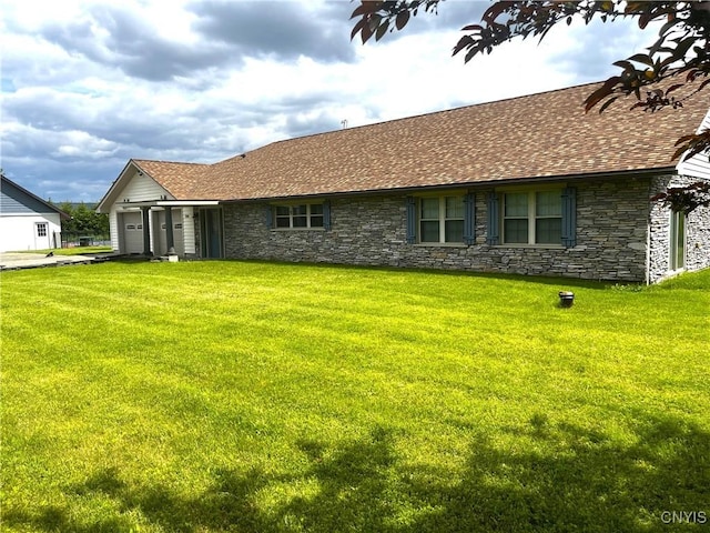 7290 State Route 80, Fabius, NY 13063 - rear view of property with stone siding, an attached garage, a yard, and a shingled roof
