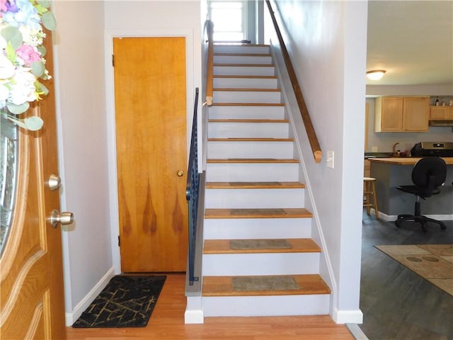 8 Dayne St, Irondequoit, NY 14622 - staircase with baseboards and wood finished floors