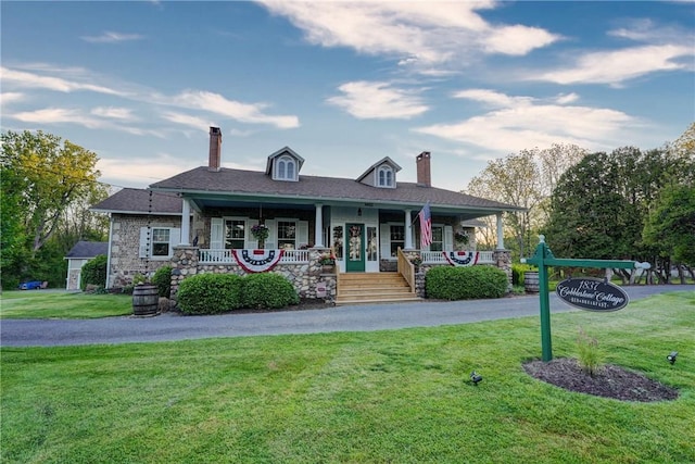 3402 W Lake Rd, Canandaigua Town, NY 14424 - view of front of property with a chimney, a porch, and a front yard