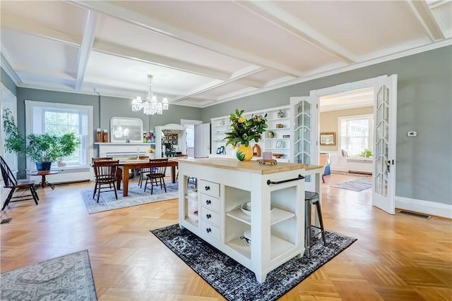 3402 W Lake Rd, Canandaigua Town, NY 14424 - kitchen with open shelves, a chandelier, coffered ceiling, baseboards, and plenty of natural light