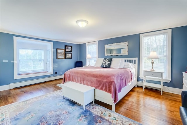 3402 W Lake Rd, Canandaigua Town, NY 14424 - bedroom featuring baseboard heating, wood finished floors, crown molding, and multiple windows