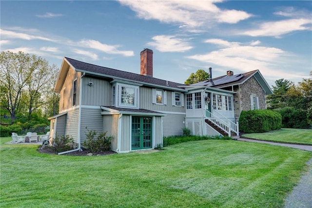 3402 W Lake Rd, Canandaigua Town, NY 14424 - back of house featuring french doors, a chimney, a yard, and stairway