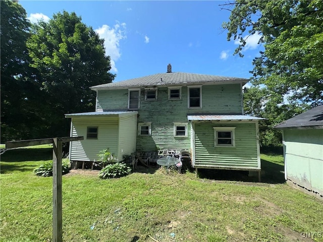 24593 Back St Unit 599, Rutland, NY 13638 - back of property featuring a lawn and a chimney
