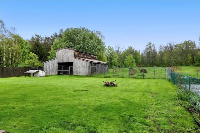5549 State Route 104th Trl, Scriba, NY 13126 - view of yard with a detached garage, a barn, and an outdoor structure