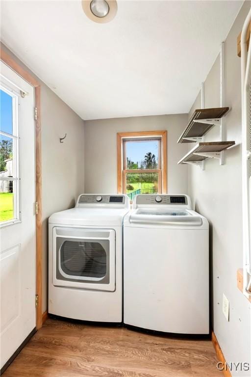 5549 State Route 104th Trl, Scriba, NY 13126 - laundry area with washer and dryer and light wood finished floors