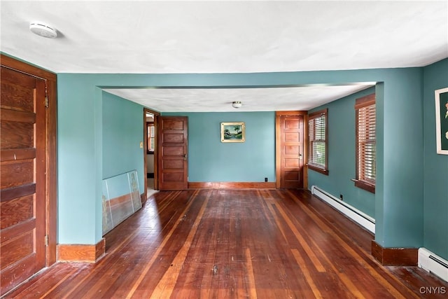 5549 State Route 104th Trl, Scriba, NY 13126 - empty room featuring a baseboard heating unit, a baseboard radiator, hardwood / wood-style floors, a smoke detector, and baseboards