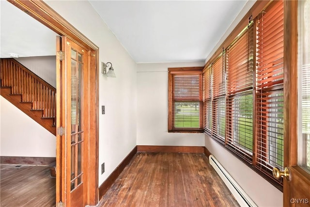 5549 State Route 104th Trl, Scriba, NY 13126 - hall with hardwood / wood-style flooring, baseboards, a baseboard radiator, and stairs