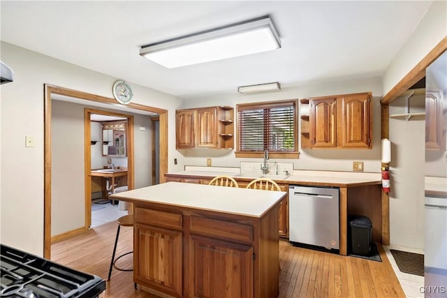 5549 State Route 104th Trl, Scriba, NY 13126 - kitchen with stainless steel dishwasher, open shelves, light countertops, light wood-type flooring, and a kitchen island
