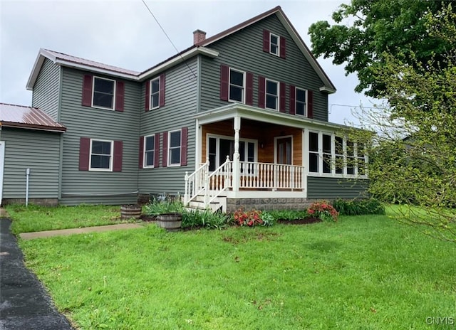 5549 State Route 104th Trl, Scriba, NY 13126 - view of front of house with a porch, a front yard, a chimney, and metal roof
