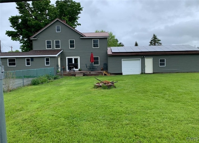 5549 State Route 104th Trl, Scriba, NY 13126 - rear view of house with solar panels, a deck, and a garage