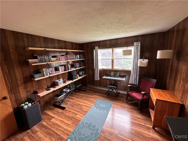 5030 Lincklaen Rd, Cuyler, NY 13158 - home office featuring wooden walls, wood finished floors, and a textured ceiling