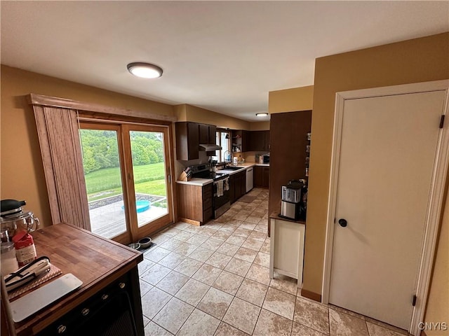 5030 Lincklaen Rd, Cuyler, NY 13158 - kitchen featuring stainless steel appliances, a sink, light countertops, light tile patterned floors, and under cabinet range hood