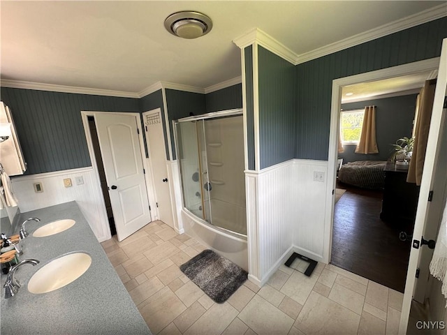 5030 Lincklaen Rd, Cuyler, NY 13158 - bathroom with wainscoting, enclosed tub / shower combo, ornamental molding, and double vanity