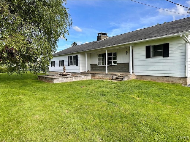 5030 Lincklaen Rd, Cuyler, NY 13158 - back of property with a chimney, a lawn, and covered porch