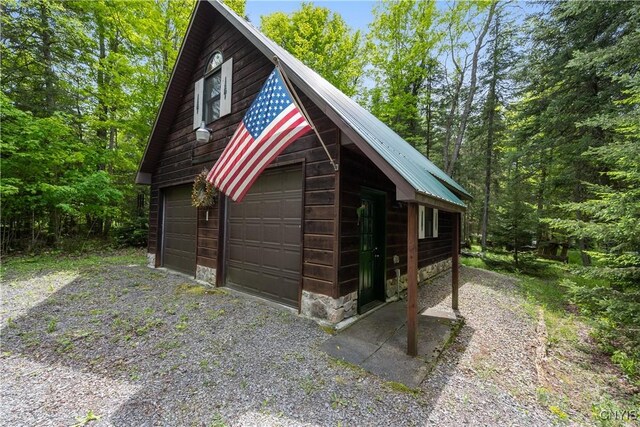 12103 Kincaid Rd, Forestport, NY 13338 - detached garage featuring a view of trees