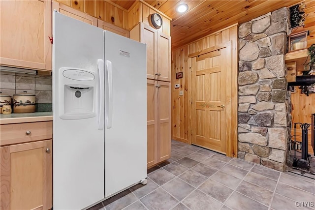 12103 Kincaid Rd, Forestport, NY 13338 - kitchen with white refrigerator with ice dispenser, wooden ceiling, light brown cabinetry, wooden walls, and light countertops