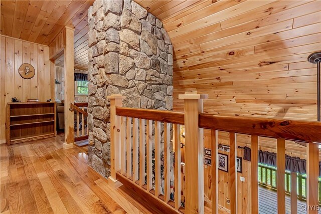 12103 Kincaid Rd, Forestport, NY 13338 - hallway featuring wooden ceiling, an upstairs landing, wood finished floors, and wood walls