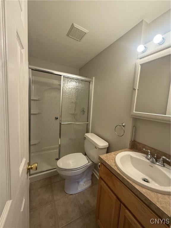 137 Watertree Dr, Dewitt, NY 13057 - bathroom featuring vanity, toilet, a shower stall, and tile patterned floors