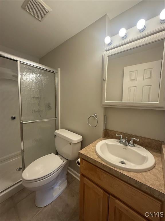 137 Watertree Dr, Dewitt, NY 13057 - full bathroom with vanity, toilet, a stall shower, and tile patterned flooring