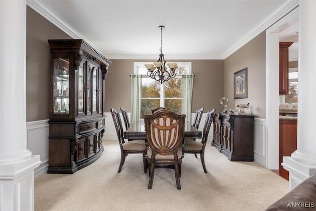 82 Arcadian Dr, Amherst, NY 14228 - carpeted dining room featuring a chandelier, crown molding, and decorative columns