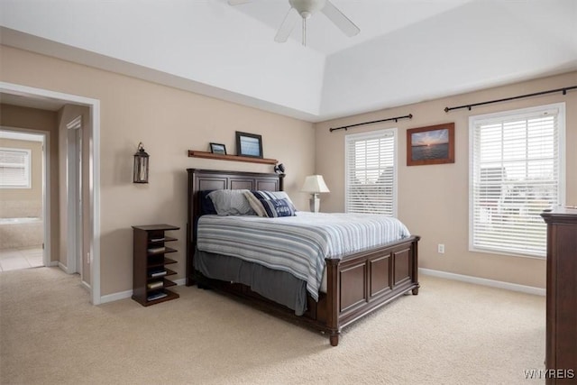 82 Arcadian Dr, Amherst, NY 14228 - bedroom with light carpet, baseboards, ceiling fan, and ensuite bath