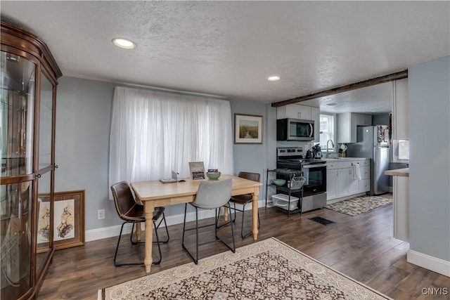 29580/584 Maple St Unit 584, Le Ray, NY 13612 - dining room featuring dark wood finished floors, a textured ceiling, baseboards, and recessed lighting