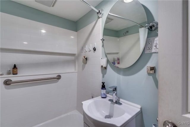29580/584 Maple St Unit 584, Le Ray, NY 13612 - full bathroom with vanity and  shower combination
