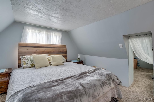 29580/584 Maple St Unit 584, Le Ray, NY 13612 - bedroom featuring carpet flooring, lofted ceiling, and a textured ceiling