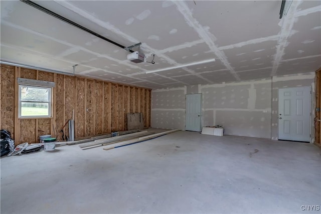 29580/584 Maple St Unit 584, Le Ray, NY 13612 - garage featuring a garage door opener