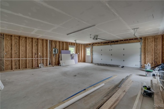 29580/584 Maple St Unit 584, Le Ray, NY 13612 - garage featuring a garage door opener