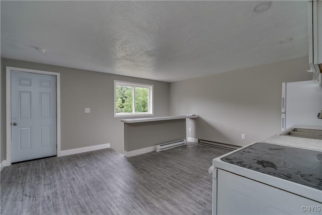 29580/584 Maple St Unit 584, Le Ray, NY 13612 - kitchen with white appliances, baseboard heating, a sink, and baseboards