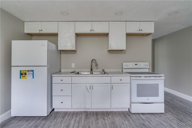 29580/584 Maple St Unit 584, Le Ray, NY 13612 - kitchen with white appliances, a sink, white cabinetry, and baseboards