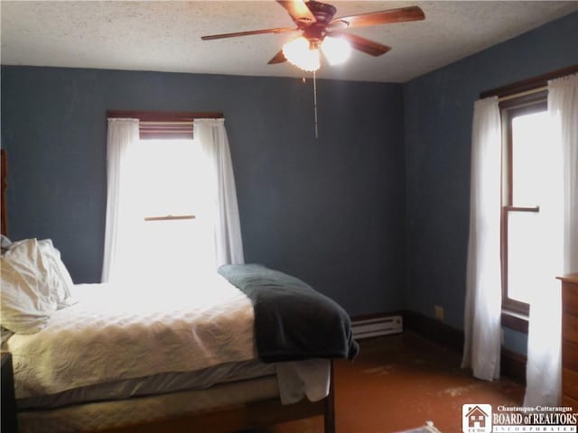 123 N Dow St, Ellicott, NY 14733 - carpeted bedroom with a baseboard radiator, multiple windows, a ceiling fan, and a textured ceiling
