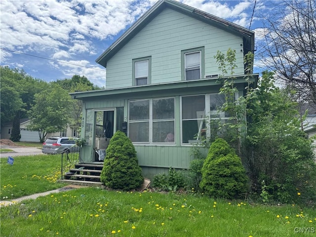 403 Coffeen St, Watertown-City, NY 13601 - american foursquare style home featuring a front lawn