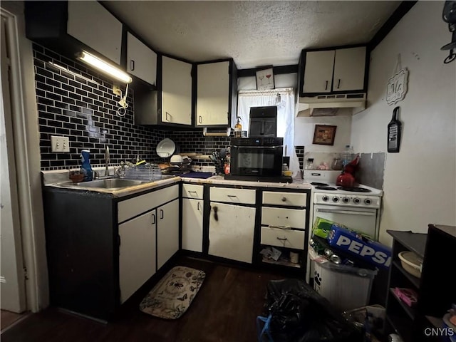 403 Coffeen St, Watertown-City, NY 13601 - kitchen with under cabinet range hood, a sink, dark wood-style floors, a textured ceiling, and tasteful backsplash