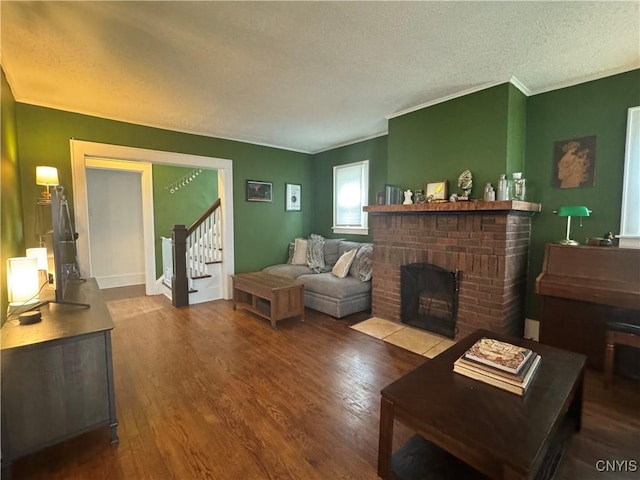 171 Maplehurst Ave, Syracuse, NY 13208 - living area with a textured ceiling, stairs, wood finished floors, a fireplace, and crown molding
