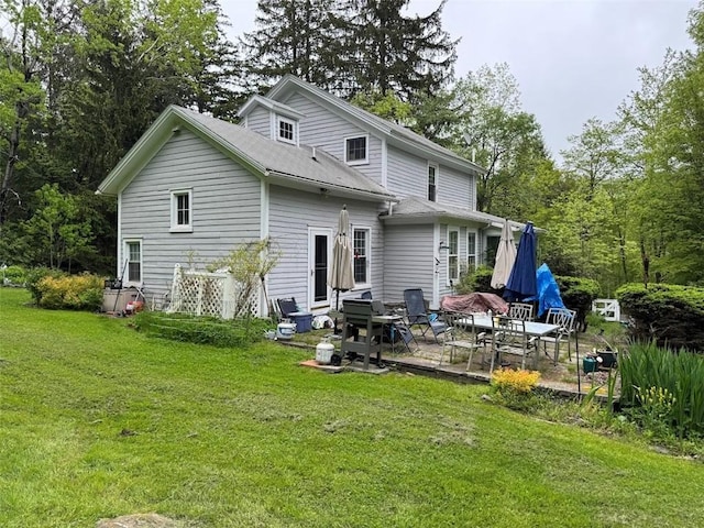 6641 Fall Clove Rd, Andes, NY 13752 - rear view of property with a yard and a patio