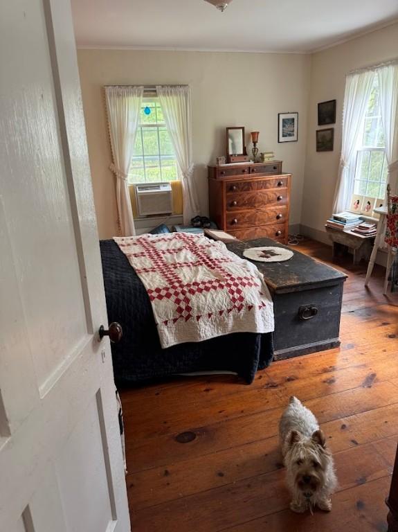 6641 Fall Clove Rd, Andes, NY 13752 - bedroom with hardwood / wood-style floors, ornamental molding, and cooling unit