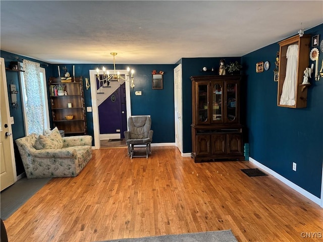 58 S Hamilton St, Elbridge, NY 13080 - sitting room featuring a chandelier, wood finished floors, and baseboards