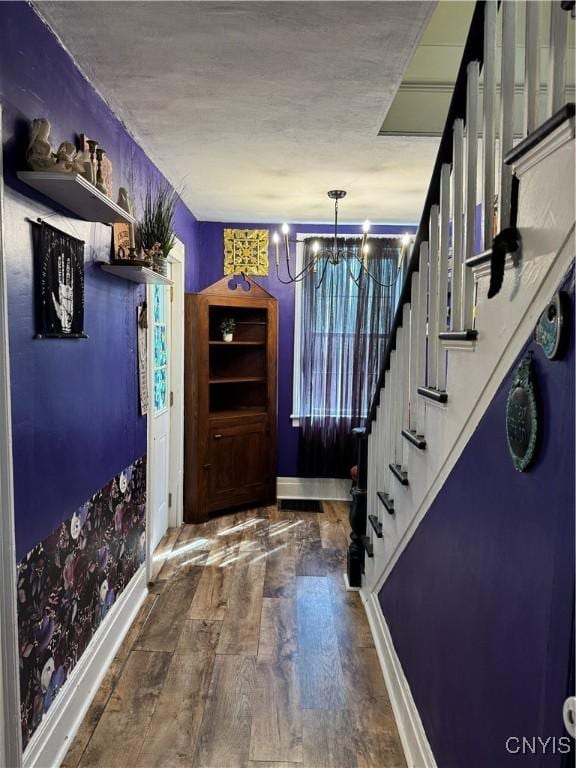 58 S Hamilton St, Elbridge, NY 13080 - foyer with baseboards, a chandelier, wood finished floors, stairway, and a textured ceiling