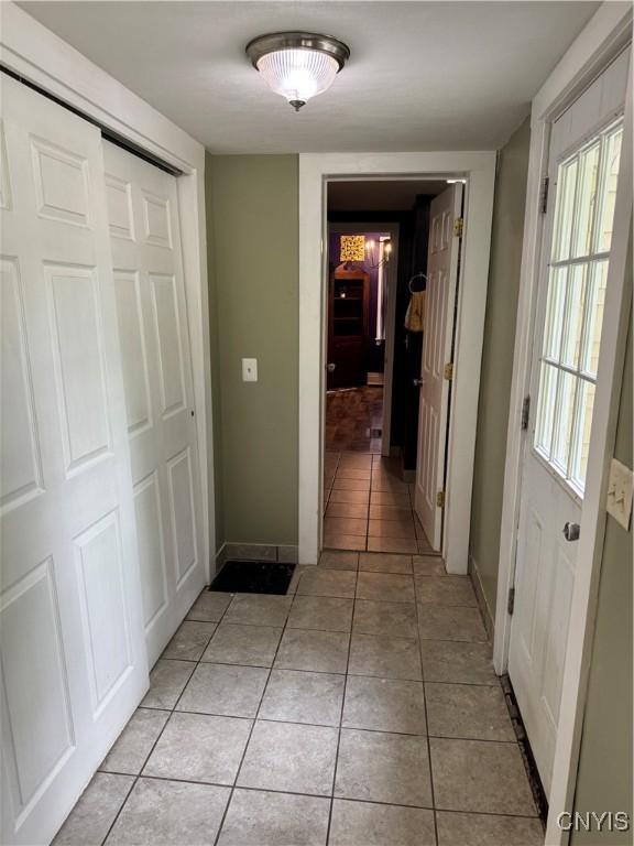 58 S Hamilton St, Elbridge, NY 13080 - corridor with light tile patterned floors and baseboards