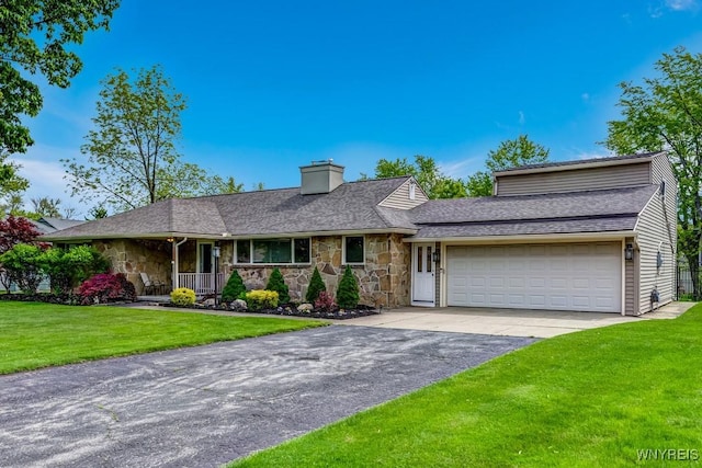 515 Park Club Ln, Amherst, NY 14221 - view of front facade with stone siding, a front lawn, a chimney, asphalt driveway, and a garage
